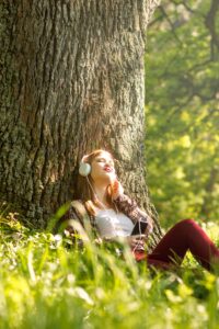 Woman listening to music to help rewire her brain from addiction