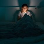 Women addicted to Social Media in Bed