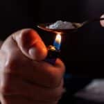 Person who is Freebasing drugs