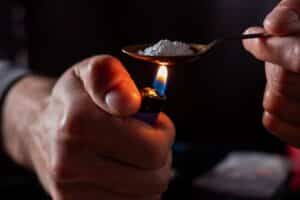 Person who is Freebasing drugs